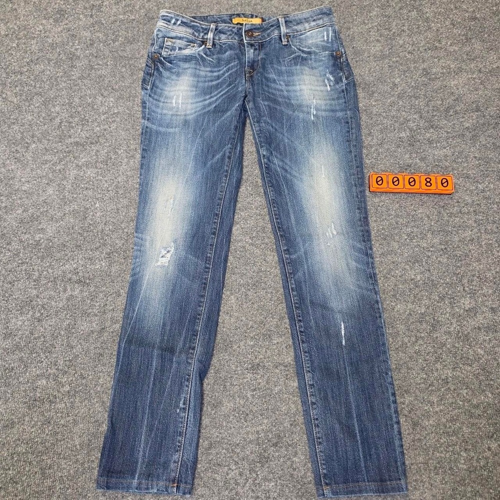 Blue denim jeans with a distressed look. Size 30 x 32